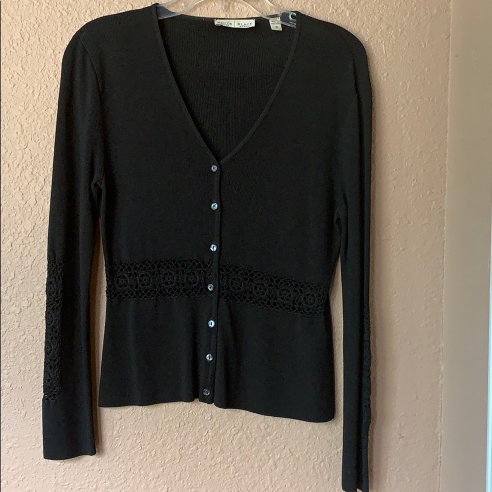 Black button up sweater.